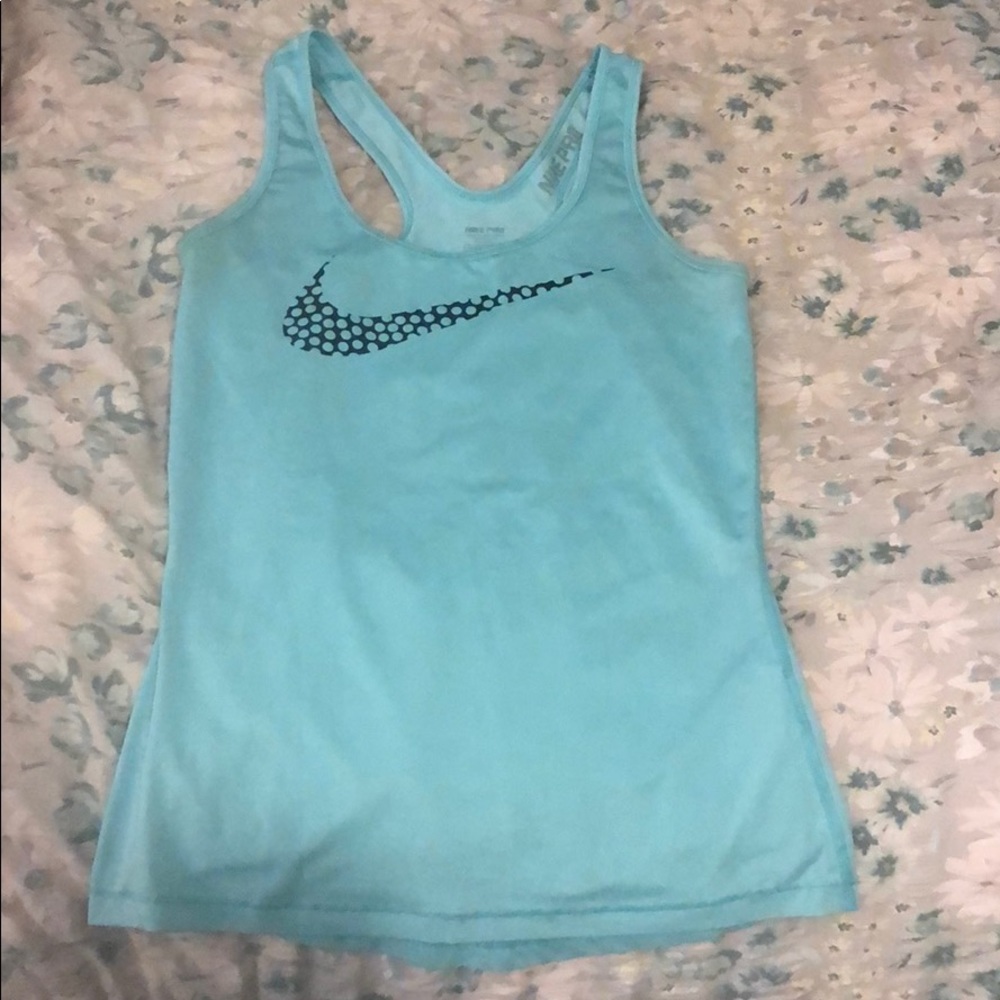 Blue Nike tank top.